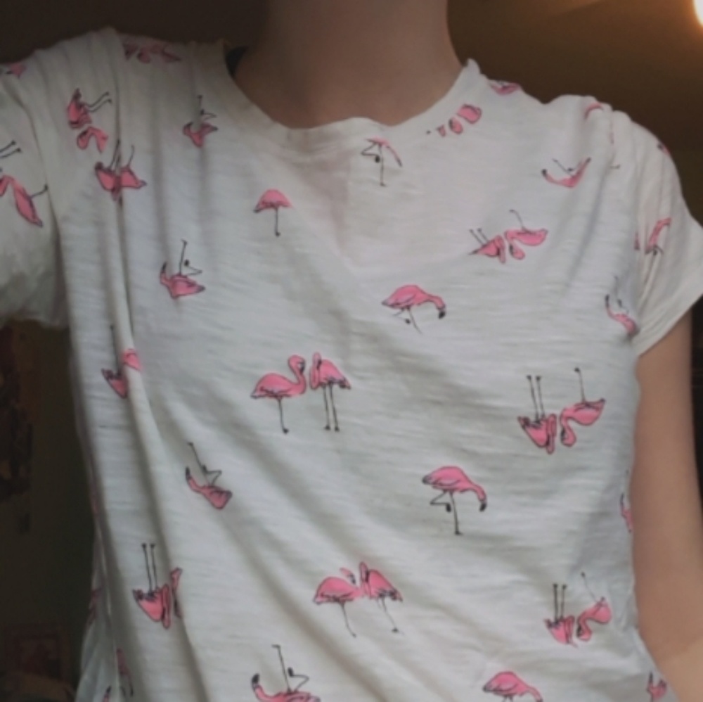 White T-shirt with pink flamingos on it